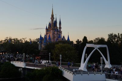 Castle and Tomorrowland bridge at dusk