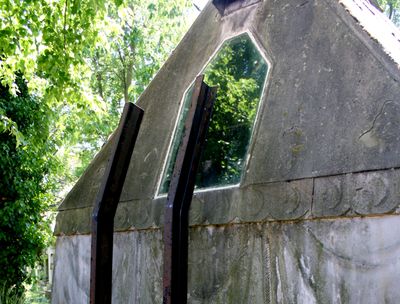 The mausoleum has a window in the back