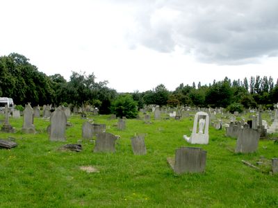 The cemetery is on a hill that slopes away up in the direction of the shot