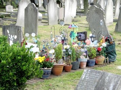 A very well kept grave. I like to see lots of flowers