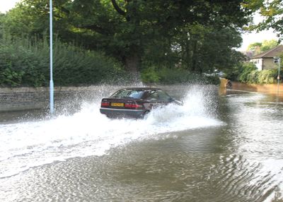 The best way to drive through a flooded road is slowly, not many people know that.