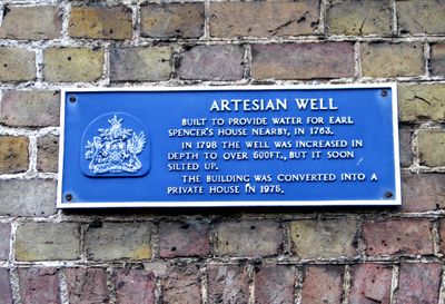 The plate on the wall of the Artesian well