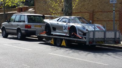 A Noble M??? on the trailer, towed by a Range Rover