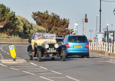 A yellow Rolls Royce