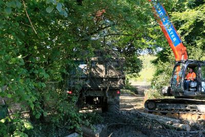 Putting the silt onto a lorry to take away