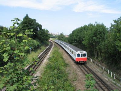 Tube train approaching Wimbledon Park Station