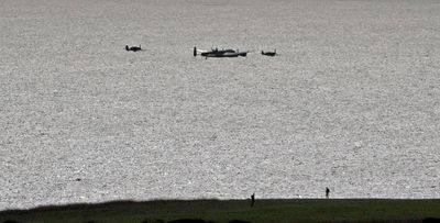 Lancaster and 2 Spifires, possibly. taken from Beachy Head