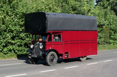My Guess, this vehicle is from WW2 and the box on the roof is filled with gas, which runs the van