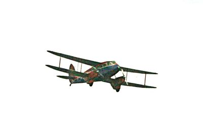 Biplane. Bright colours. Much enlarged. Somewhere over the Solent.