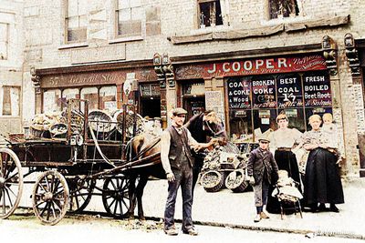 My Grandad William Cooper holding the horse, the shop was owned by his brother.