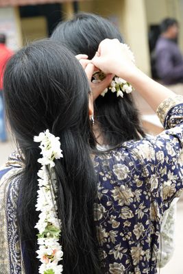 Fixing her hair