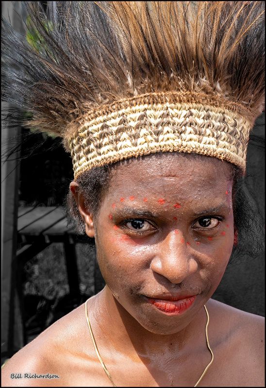 Asmat woman with beetle nut red lips.jpg
