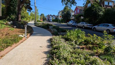 20250630_011009458 Rainway sidewalk hill south view.jpg