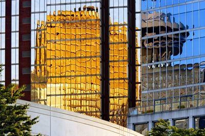 Reflections of the Granville Square Building and the Harbour Centre Tower
