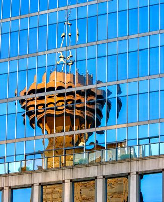 Reflections of the Granville Square Building and the Harbour Centre Tower