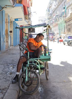 Street seller of cockroach killer spray