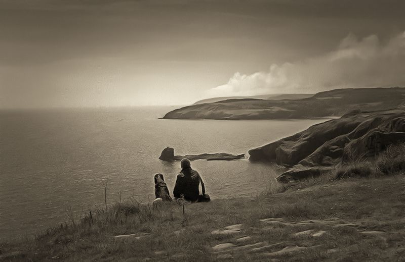 Taking a break at Berry Head looking along the south coast of Devon, UK