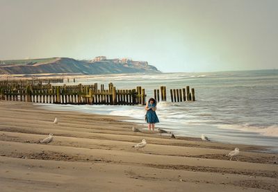 The lady on the phone but not one Seagull can receive her call..jpg