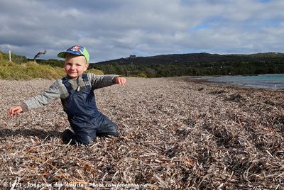 Guus playing on the washed up kelp