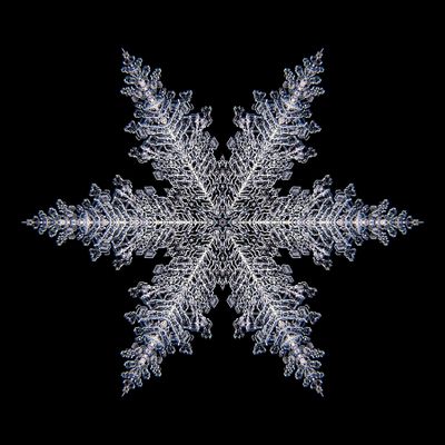 Kaleidoscopic snowflake created with a real natural frost structure