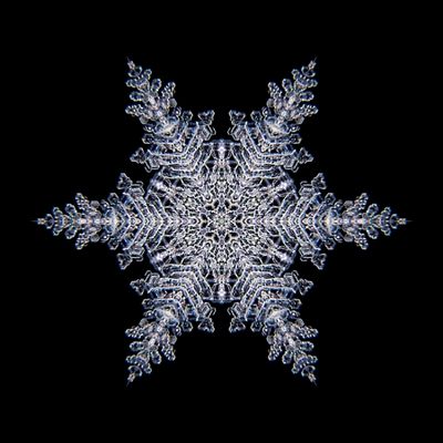 Kaleidoscopic snowflake created with a real natural frost structure