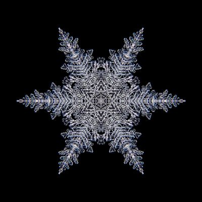 Kaleidoscopic snowflake created with a real natural frost structure