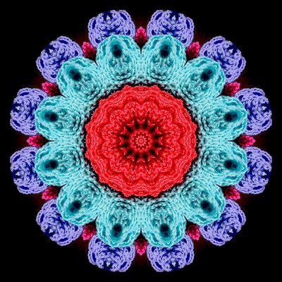 Kaleidoscopic picture created with textile art