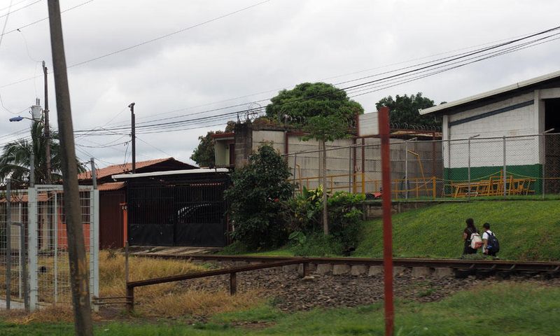 Kids going to school alongside a railroad line north of San Jose