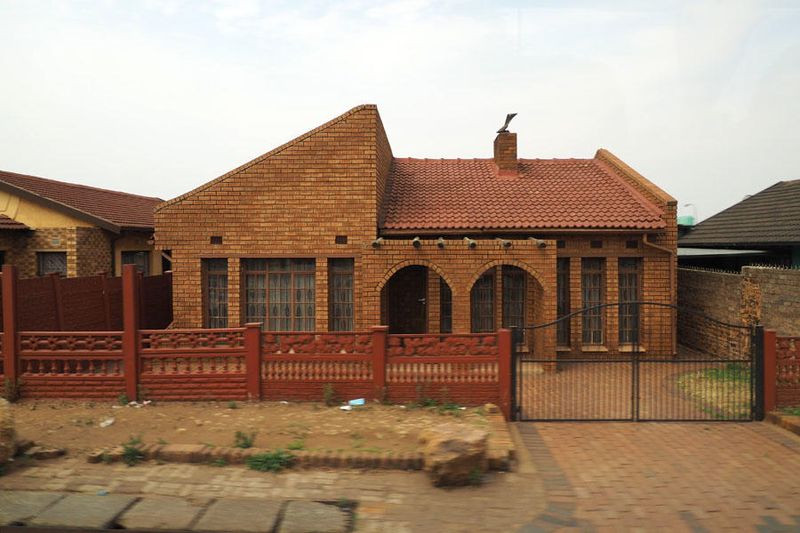 A nice looking house beside the road