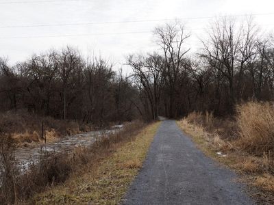 The trail runs through an open area