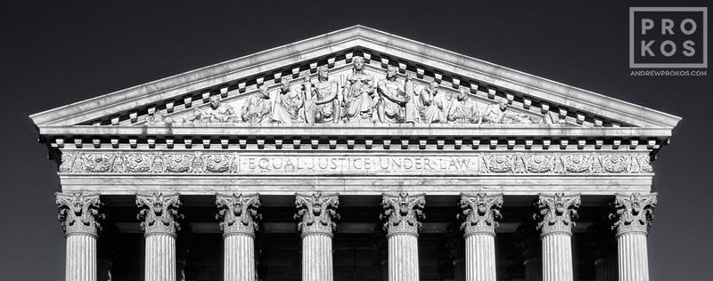Panoramic black and white fine art photography print of the US Supreme Court Building Pediment from the Washington DC framed prints gallery of architectural photographer Andrew Prokos. Captured via panoramic film photography. 