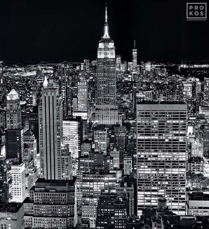 Black and white photographs fine art photo print of the Empire State Building and Manhattan skyline from Rockefeller Center at night found in the night photography, New York skylines, Empire State Building photos, Rockefeller Center photos galleries of framed art photography artist Andrew Prokos. You can read more about Andrew's work in his pro photography article page.