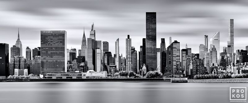 Black and white photographs framed photos of the Midtown Manhattan skyline captured with  long-exposure photo technique, New York skyline, Brooklyn Bridge photos, New York cityscape galleries of photography artist artist Andrew Prokos. You can read more about Andrew's work in his pro photography articles page.