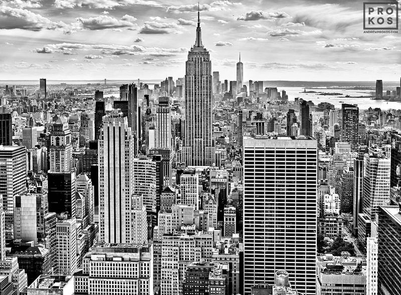 Black and white cityscape and framed photography print of the View of Empire State Building and Manhattan from Rockefeller Center found in the panoramic photos, New York cityscapes, Black and white skylines, Empire State Building images, and Rockefeller Center images galleries of fine art photography site of artist Andrew Prokos. You can read more about Andrew's work in his pro photography student advice page.