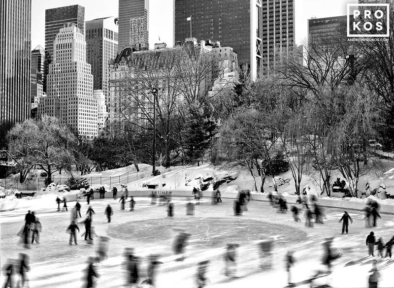 Black and white photograph of a B&W landscape of Ice Skaters in winter in Central Park by NYC photographer Andrew Prokos. Limited edition photographs are available up to 60 inches in width. Ships from the artist's New York photo gallery
