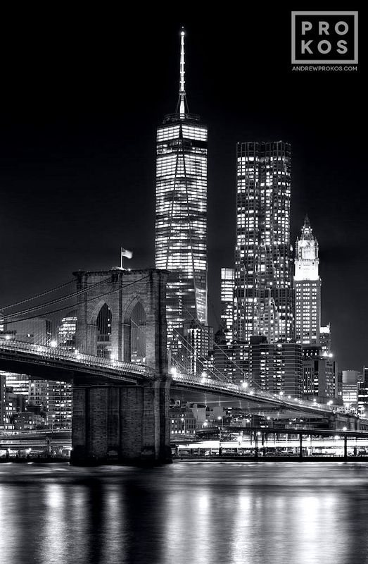 Limited edition black and white photograph of the Brooklyn Bridge and World Trade Center at night by master New York skylines photographer Andrew Prokos. Composed of multiple black and white photos taken with long exposure photography technique, meticulously merged to create  large scale framed photographs up to 90 inches in height. Please inquire regarding additional print sizes. Artwork ships direct from the artist's NYC photo gallery.