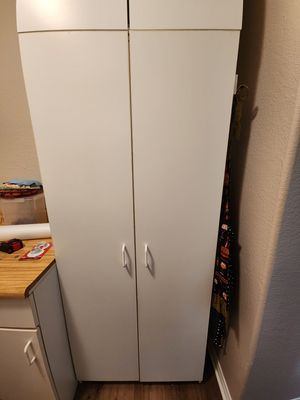 Moved cabinet to hang aprons on side.jpg
