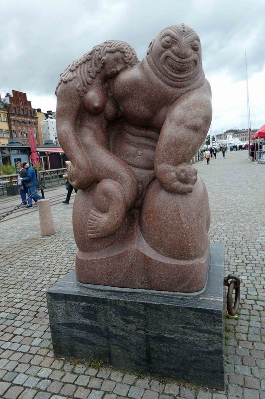 Sjogudvn (Sea God) is a 1913 red granite sculpture on a quay in Stockholms Gamla Stan