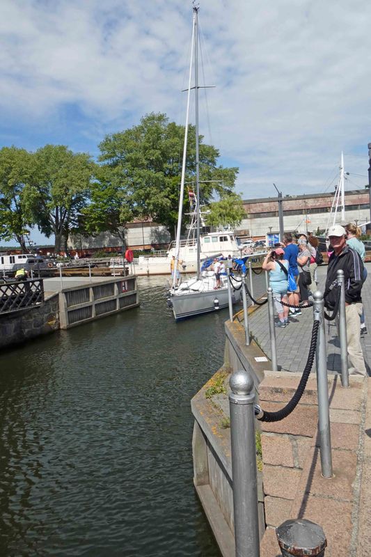 Boats passing through the opening created by the rotating bridge in Klaipeda