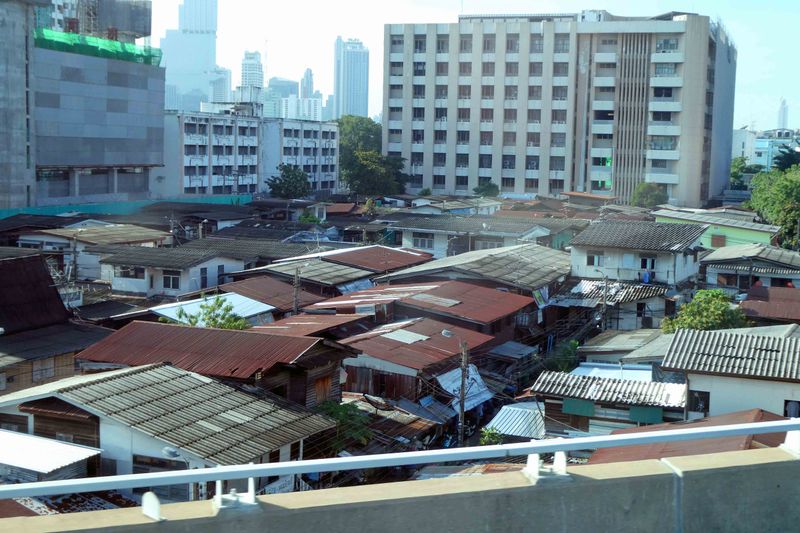 Older neighborhoods still exist among newer buildings across Bangkok