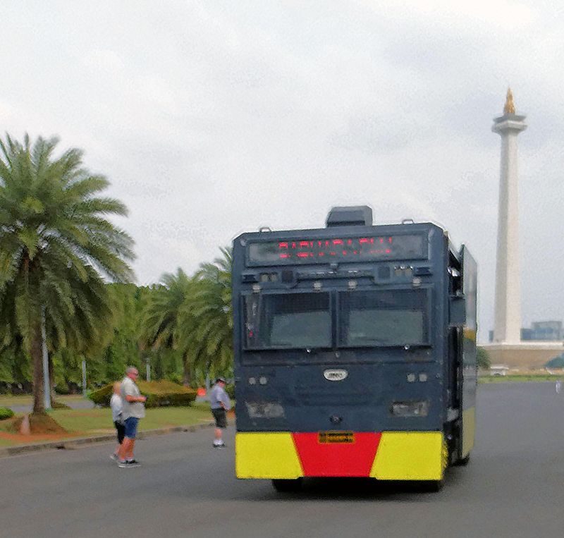 Moving out of the way of a SWAT vehicle in Jakarta, Indonesia