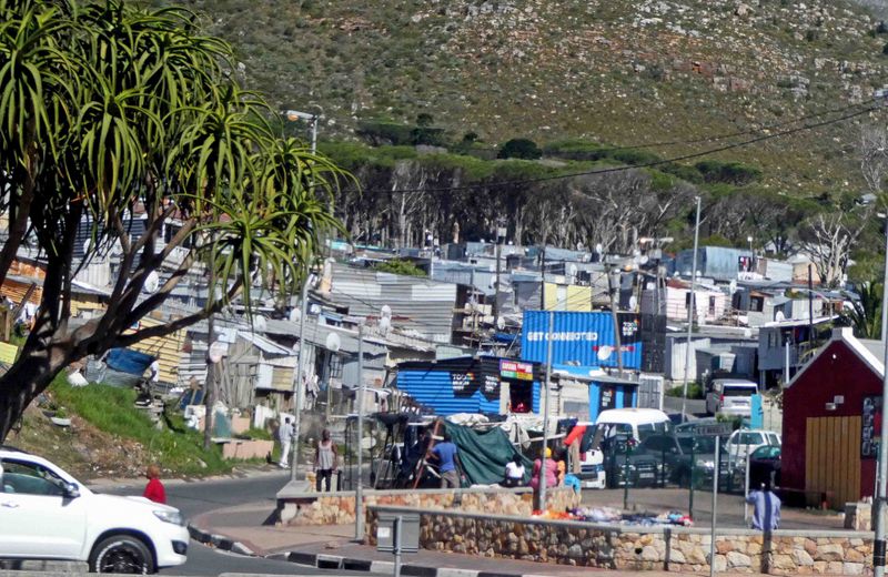 These are called squatter camps or informal settlements in South Africa.JPG
