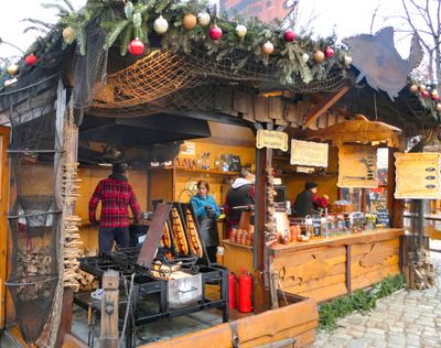 Fish grilled over an open fire at the Christmas Market at Charlottenburg Palace in Berlin