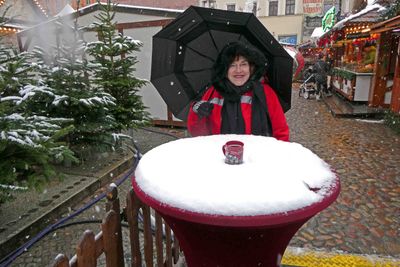Cooling our Gluhwein in the snow at the Wittenberg Christmas Market