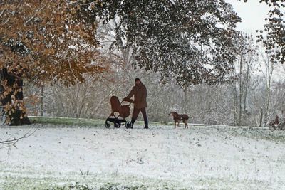 Wallking the dog and the baby in the snow