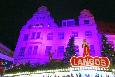 Langos is a Hungarian dish with fried dough filled with cheese and other toppings