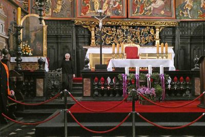 The two panels of the triptych (weighing 1,000 pounds each) were opened by this tiny nun