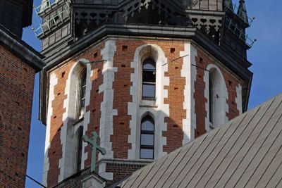 A bugler stands in one of the tower windows in St. Mary's Basilica in Krakow