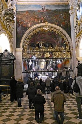 Pilgrims who visit the Black Madonna walk around the icon on their knees