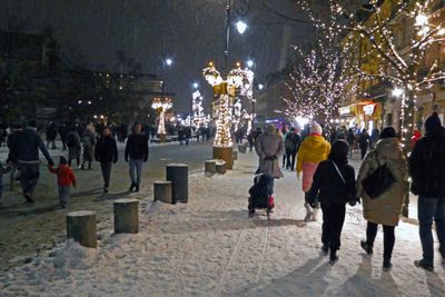 Crowds on a snowy night in Warsaw, Poland